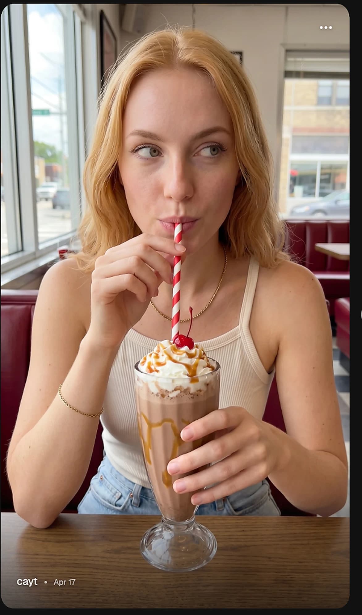 A Kallfi Soul enjoying a milkshake in a diner.